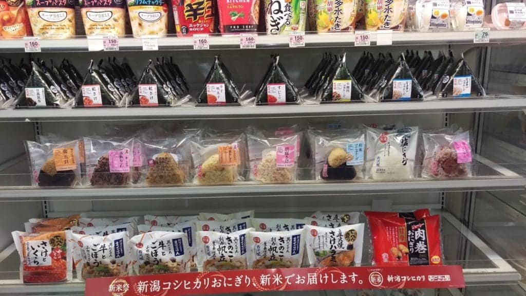 A store shelf with Onigiri on display
