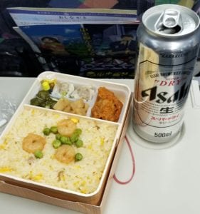 Ekiben or Train Bento with rice, chicken, dumplings and a beer